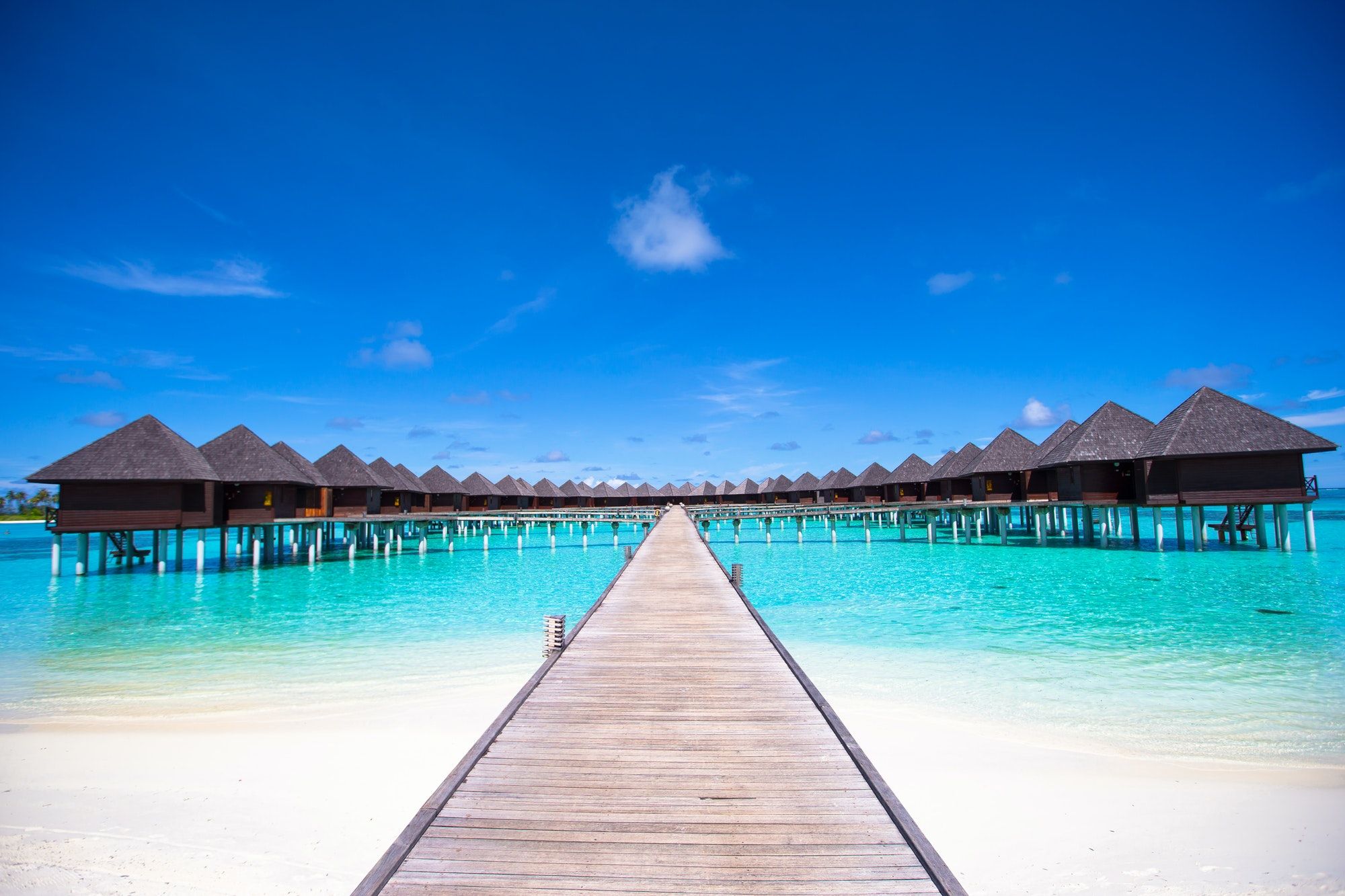 water-bungalows-and-wooden-jetty-on-maldives-1.jpg